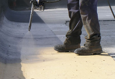 Coating systems over Des Moines spray foam roof systems